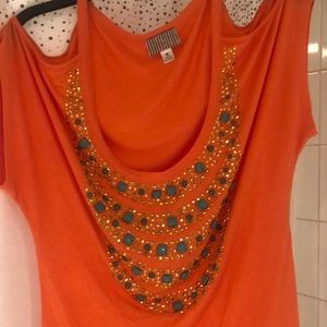 Casual orange open shoulder shirt.